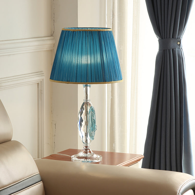 Traditional Clear Crystal Night Light With Blue Fabric Shade And Oblong Base
This Revised Title