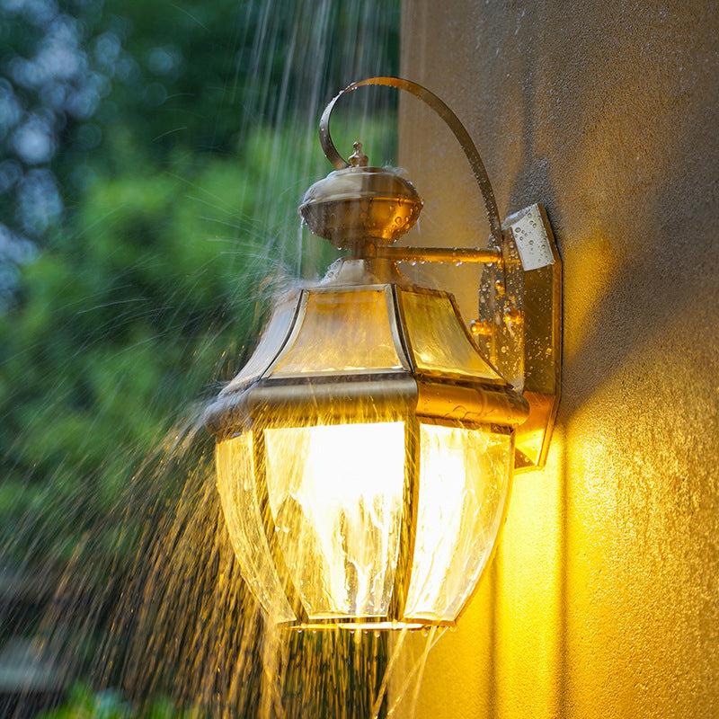 Traditional Clear Glass Globe Wall Light - 1-Light Outdoor Lantern Sconce In Brass