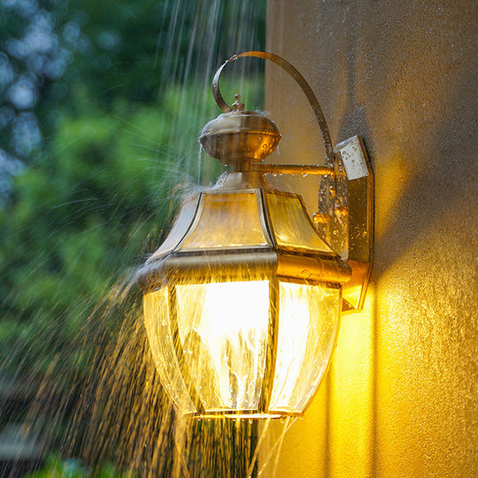 Traditional Clear Glass Globe Wall Light - 1-Light Outdoor Lantern Sconce In Brass