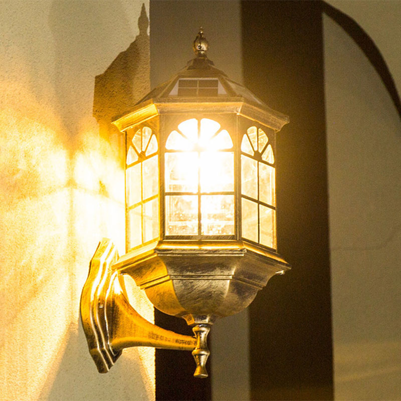 Traditional Outdoor Solar Wall Light Fixture With Metallic House Shaped Design And Clear Glass Shade