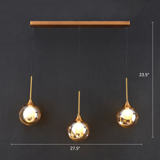 Minimalist Glass Pendant Light With 3-Head Design For Dining Room And Multiple Hanging Options Amber