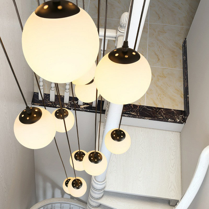 Minimalist Black Globe Pendant Light With Cream Glass - Ideal For Stairways