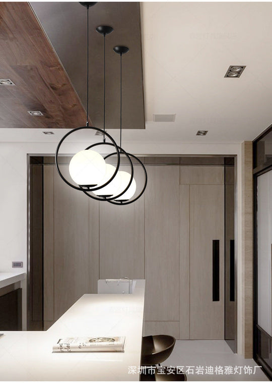 White Glass Pendant Light With Mid-Century Globe Design And Metal Ring