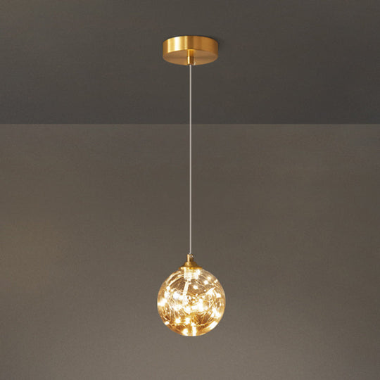 Amber Glass Led Pendant Lamp With Brass Finish - Nordic Style Lighting For Bedroom