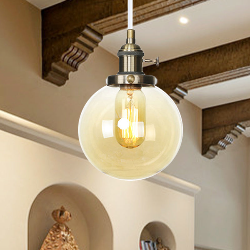 Farmhouse Orbit Pendant Light With Amber/Clear Glass And Adjustable Cord In 3 Elegant Finish