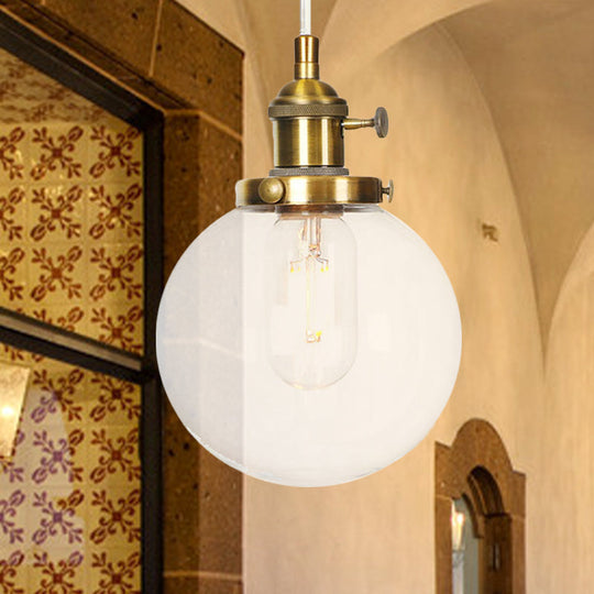 Farmhouse Orbit Pendant Light With Amber/Clear Glass And Adjustable Cord In 3 Elegant Finish