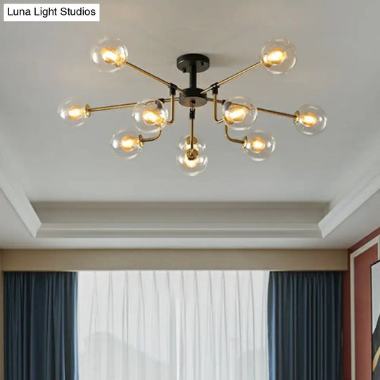 Modern Radial Chandelier With 10 Lights Black And Brass Finish Glass Ball Shades Clear