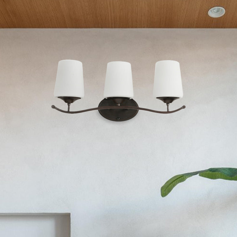 Ivory Glass Vanity Lighting With Iron Wavy Arm - Traditional Black Tapered Wall Light For Bedroom