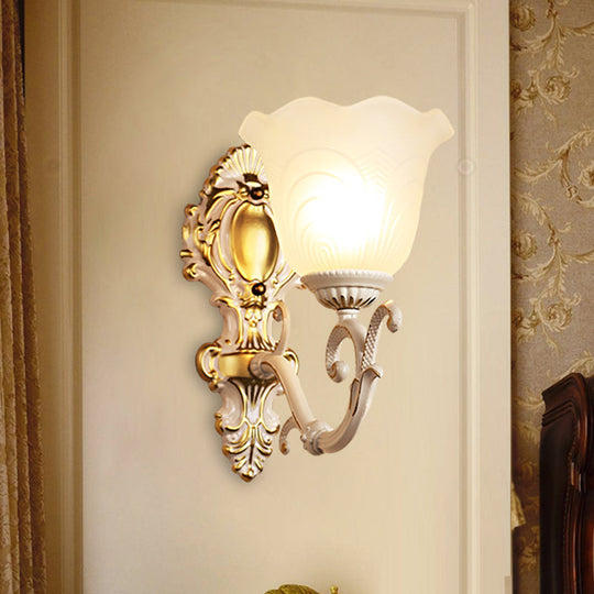 Vintage Brass/Beige Frosted Ribbed Glass Wall Sconce Lamp With Curvy Arm - 1 Light Bloom