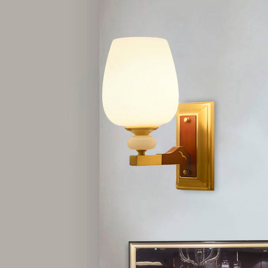 Brass Single Light Wall Mount Lamp With Opal Glass Cup Shape - Angled Lighting Idea