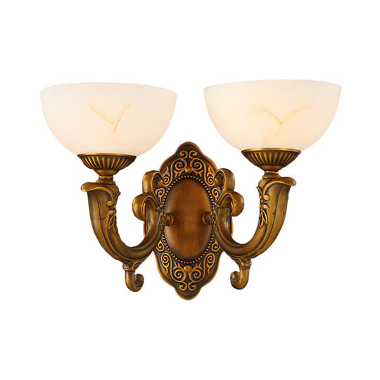 Rustic Brass Wall Sconce With Frosted Glass Shade - Swooping Arm Design For Ambient Lighting