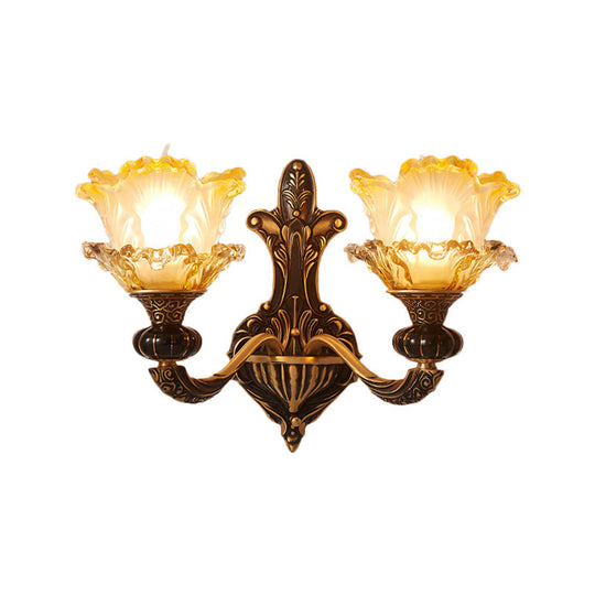 Rustic Half-Head Wall Lamp With Curvy Metallic Design And Flower Amber Glass Shade - Brass Finish
