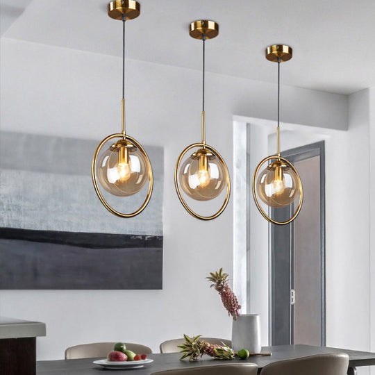 Postmodern Glass Pendant Light With Globe Down Lighting And Brass Ring For Bedroom