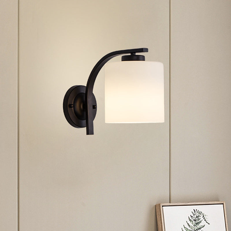 Black Wall Sconce With Ivory Glass Cylinder And Curved Arm - 1-Light Mounted Lamp