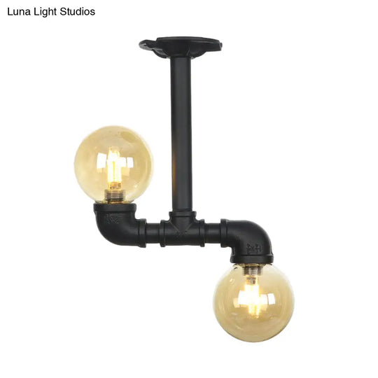 2-Head Semi-Flush Industrial Ball Amber Glass Ceiling Fixture In Black