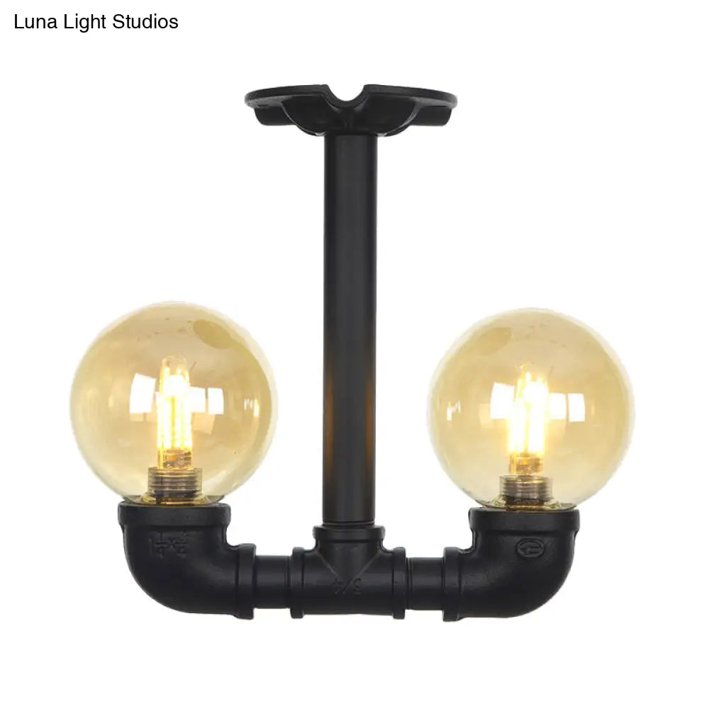 2-Head Semi-Flush Industrial Ball Amber Glass Ceiling Fixture In Black