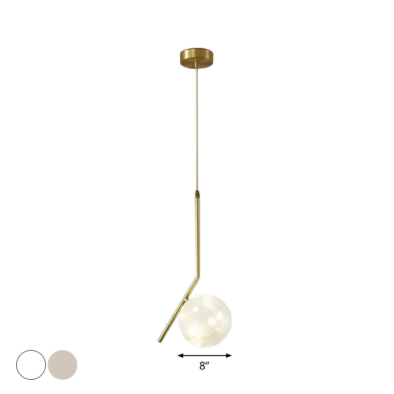 Sleek Brass Sphere Led Pendant Lamp For Modern Dining Rooms