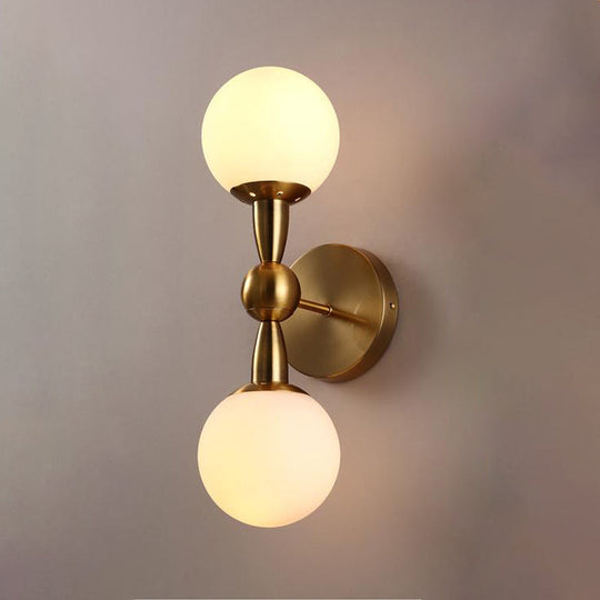 Contemporary White Glass Bedside Wall Light In Gold - Spherical Lighting Fixture