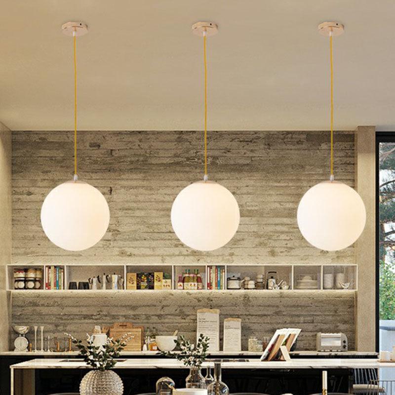 Sleek White Glass Pendant Light For Minimalist Table Settings