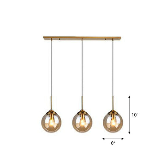 Sleek Glass 3-Bulb Brass Suspension Pendant Light For Minimalistic Dining Room Decor