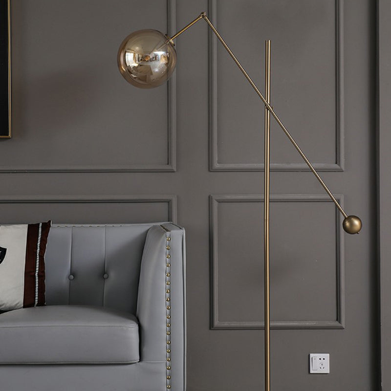 Simplicity 1-Light Bronze Amber Glass Sphere Floor Lamp With Balance Arm