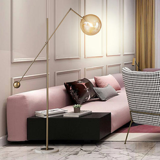 Simplicity 1-Light Bronze Amber Glass Sphere Floor Lamp With Balance Arm