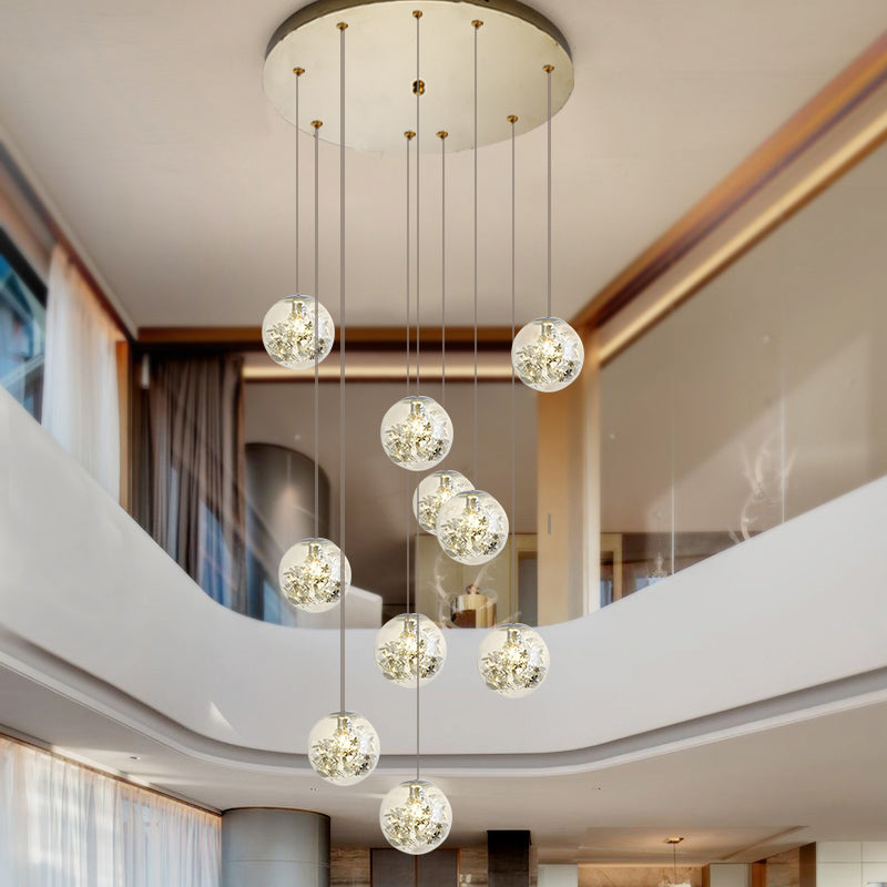 Minimalist Clear Glass Sphere Chandelier With Gold Metal Flower Decor - 10-Head Stairs Pendant Lamp
