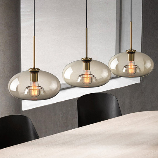Contemporary Brass Pendant Light With Clear Glass Shade - Oval/Drum/Cylinder 1-Light 7/10/11 Wide