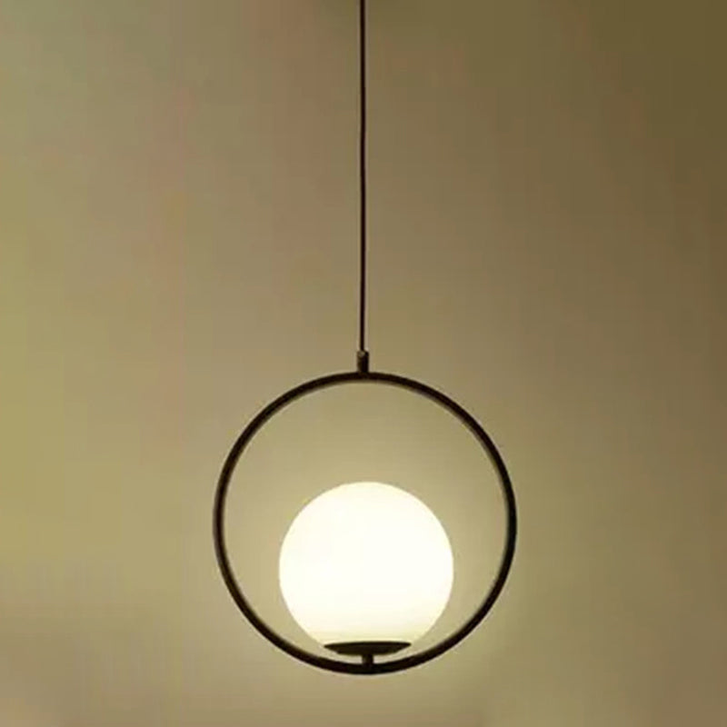 White Glass Pendant Light With Mid-Century Globe Design And Metal Ring