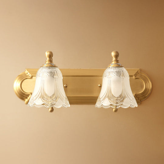 Brass Armed Wall Sconce With Ribbed Glass Shade For Bathroom Decoration