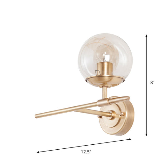 Contemporary Hand Blown Glass Wall Light With Brass Globe And Crossed Arm