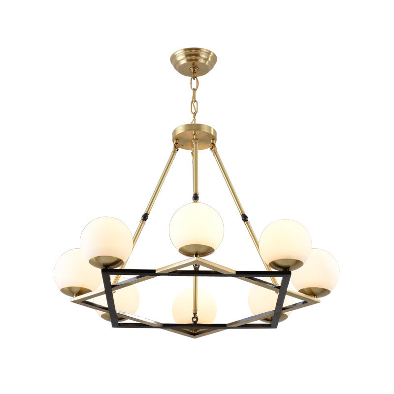 Postmodern Polygon Metal Chandelier With Brass Finish And Globe White Glass Shades