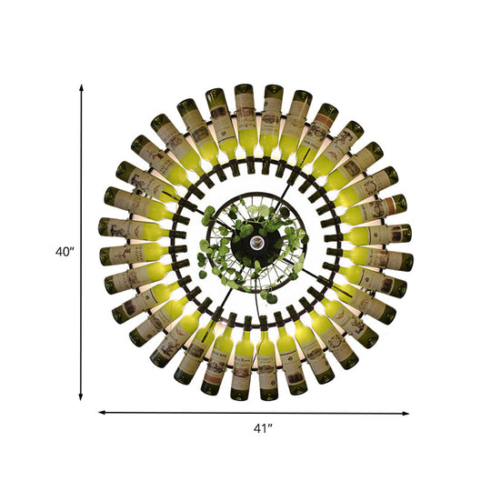 Industrial Led Wine Bottle Wall Sconce With Metal Fixture And Plant Accent In Black