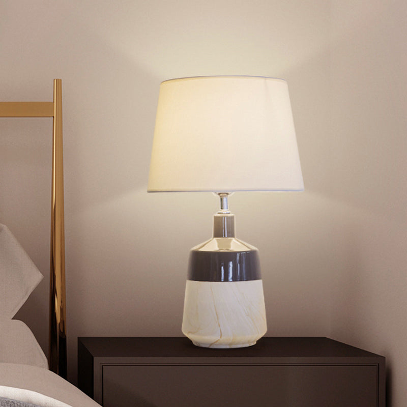 Contemporary 1-Head Bedside Night Lamp In White With Ceramic Base: Fabric Drum Table Lighting