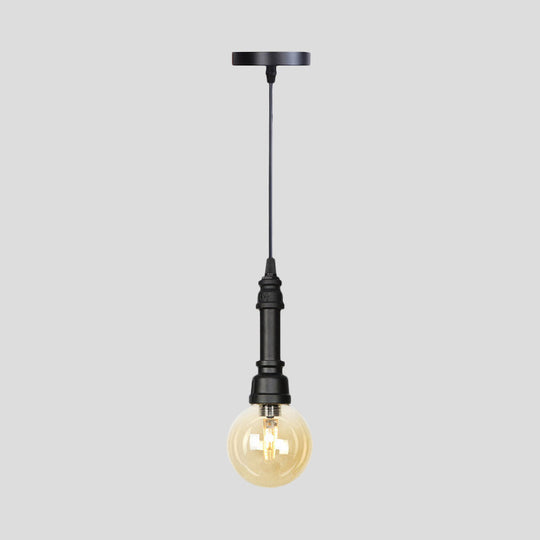 Industrial Black Finish Amber Glass Pendant Lamp With Pipe Suspension - 1-Light Ball/Capsule