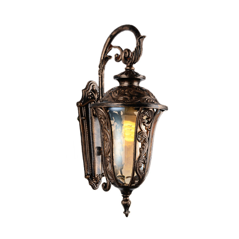 Bronze Metal Outdoor Wall Sconce With Curved Arm Amber Glass Shade - 1-Light Lamp