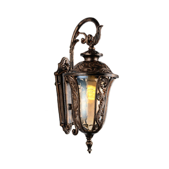 Bronze Metal Outdoor Wall Sconce With Curved Arm Amber Glass Shade - 1-Light Lamp