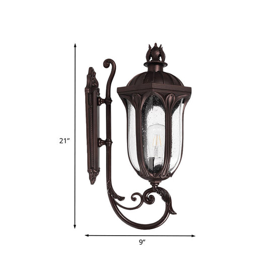 Lodge 1-Head Courtyard Wall Light Fixture With Seedy Glass And Swooping Arm In Dark Coffee