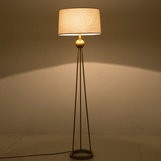 Modernist 1-Light Tripod Floor Lamp In White/Black/Flaxen With Drum Fabric Shade For Living Room