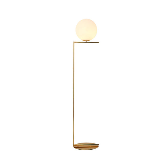Modern Frosted Glass Spherical Floor Lamp With Gold Finish And Right Angle Arm