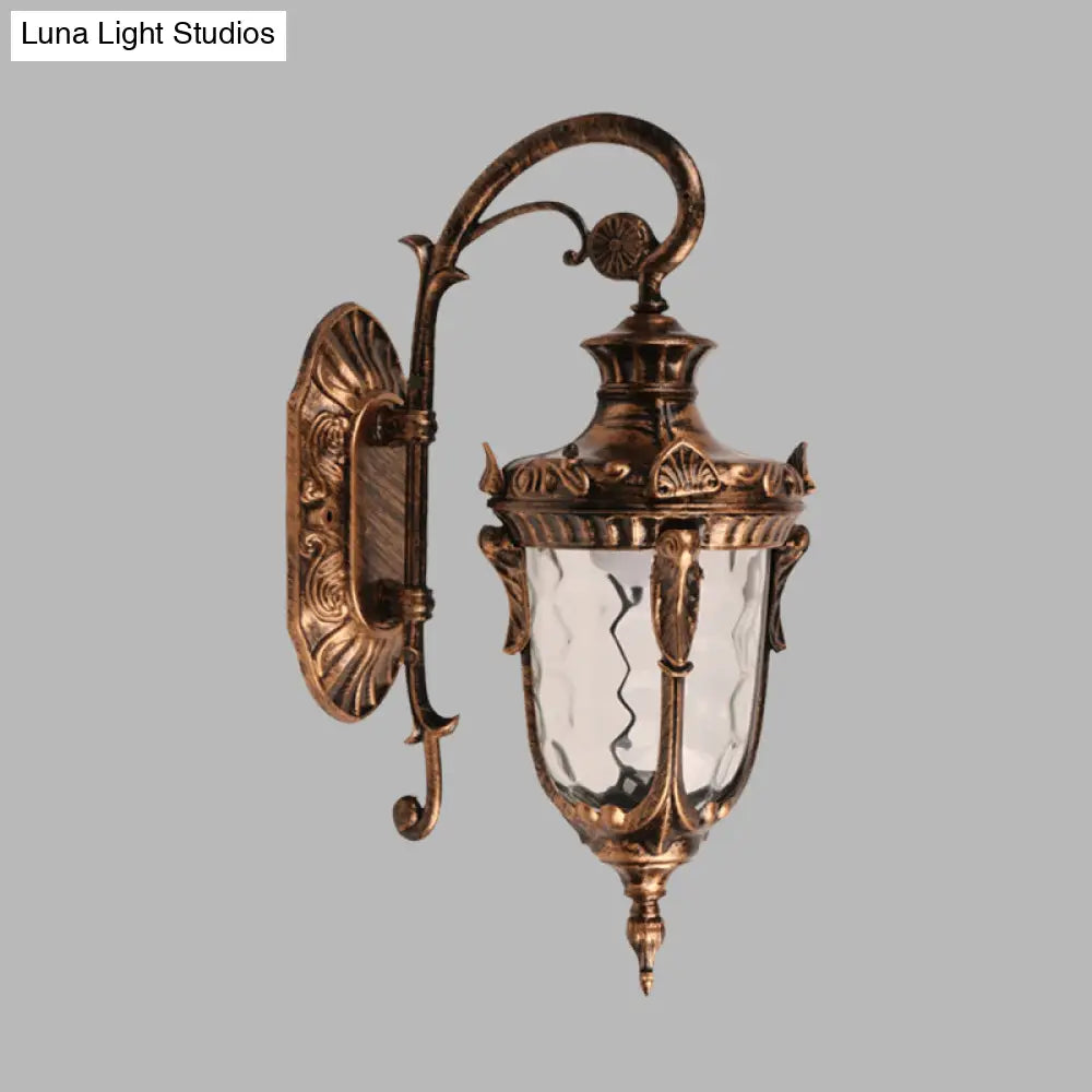 Acorn Glass Wall Sconce With Clear Water In Brass Finish