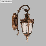 Acorn Glass Wall Sconce With Clear Water In Brass Finish