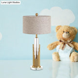 Ankaa - Modernist Round Shade Fabric Night Light 1 Head Flaxen Table Lamp With Gold Fluted Base