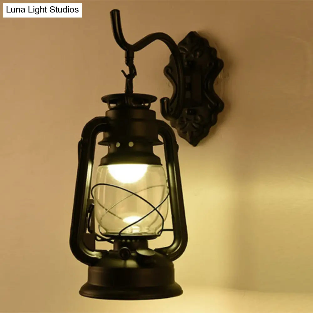 Antique Style Single-Bulb Oil Lantern Sconce: Clear Glass Wall Mount Light For Aisles Black / Curved