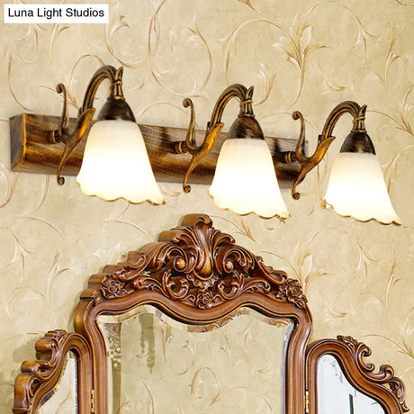 Bronze Wall Lamp With Country Flower Shade And White Rid Glass For Vanity Lighting