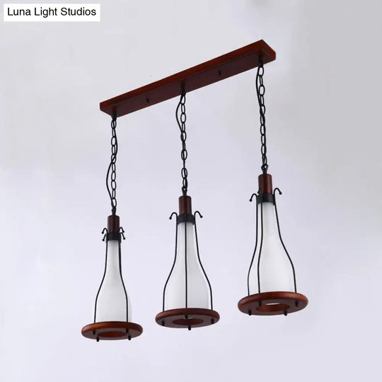 Brown Bottle Pendant Light With Cluster Design - Yellow/White Glass 3 Heads For Dining Room Ceiling
