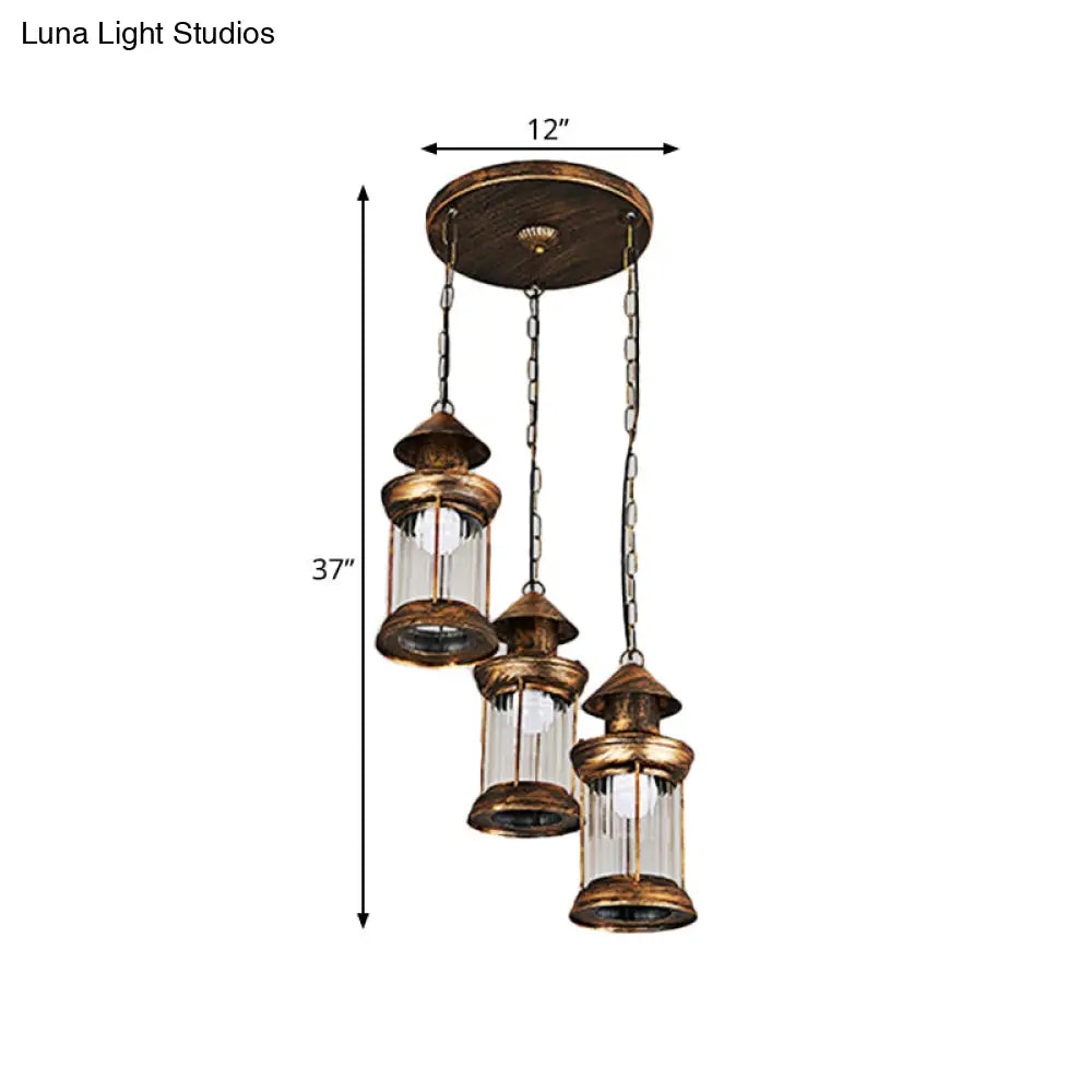 Coastal Kerosene 3-Head Pendant Lamp In Brass With Clear Ribbed Glass Shade