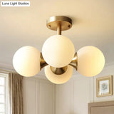 Contemporary Gold Ball Semi Flush Ceiling Light With 4 Milky Glass Heads