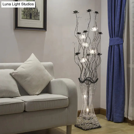 Contemporary Torch-Like Led Floor Light With Curvy Arm And Floret Decor In Black/Silver