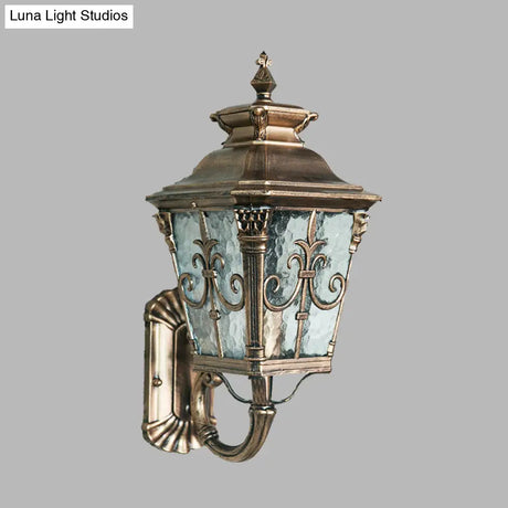 Country Brass Outdoor Wall Sconce With Pointed Flower Design